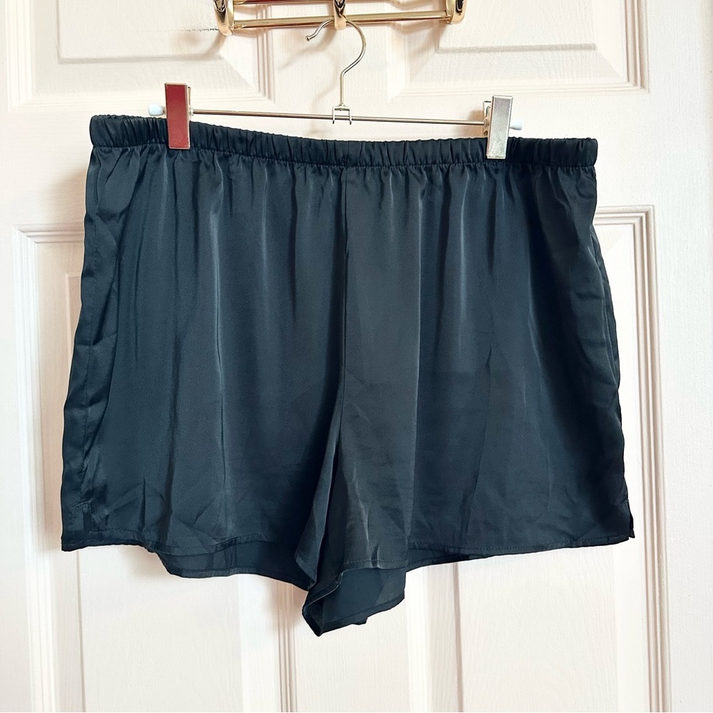 Black stars above satin shorts